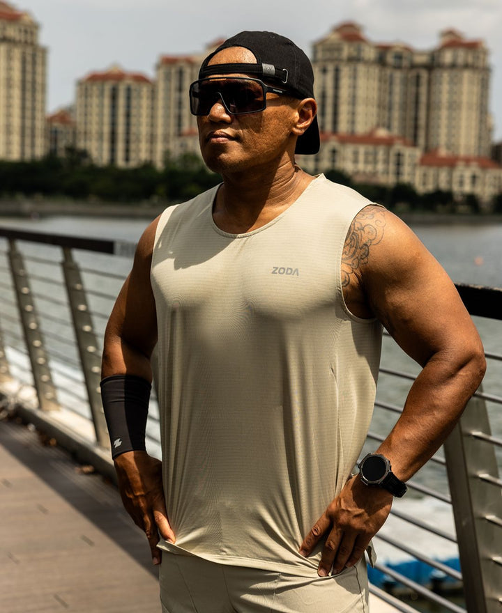 Man in athletic wear standing outdoors with buildings in the background Zoda.sg