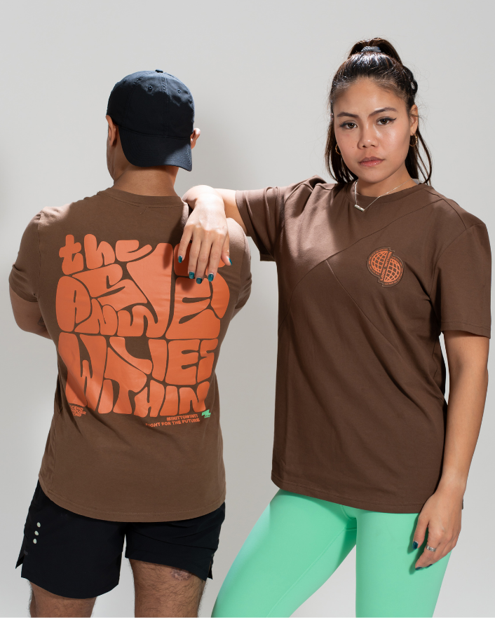 A male and a female model wearing brown oversized tees with text and logo graphics on the front. Workout gear - Zoda.sg In it to win it, Singapore Unisex_Oversized_Tee_Cover